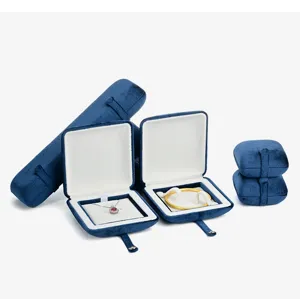 Detailed view of luxury dark blue velvet jewelry boxes set, elegant display for gifts.