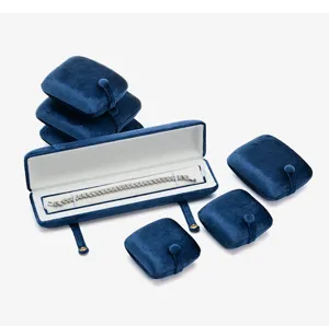 Detailed view of blue velvet jewelry box set with plush display pads and elegant bracelet case.