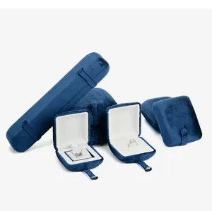 Blue velvet jewelry box set for rings and bracelets, luxury display packaging detail.