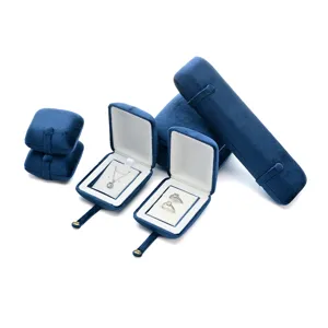 Blue velvet jewelry boxes set, elegant display case for rings, necklaces, and bracelets.