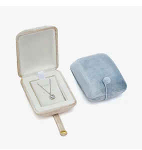 Detail shot of portable velvet jewelry box featuring soft lining, elegant design for travel use.