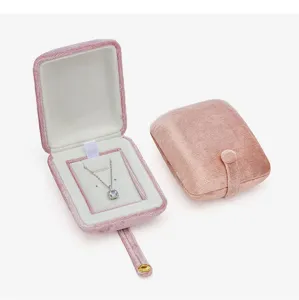 Pink velvet jewelry box detail showing soft texture, portable travel case interior design.