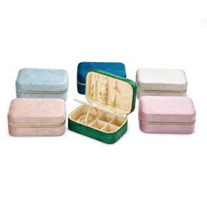 Portable velvet jewelry box organizer with zipper, multi-color travel case for rings and necklaces.