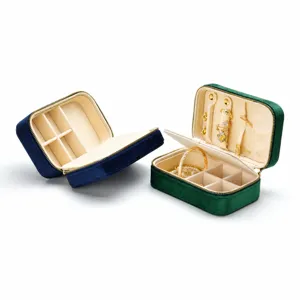 Portable velvet jewelry box organizer with zipper for rings earrings necklaces storage.