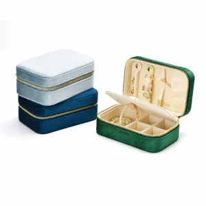 Portable velvet jewelry box with zipper travel organizer for rings earrings necklaces storage.