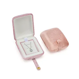 Pink velvet jewelry box for travel, portable small necklace storage organizer, elegant gift case.