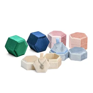 Luxury velvet hexagon jewelry box for necklace storage, portable travel gift display.