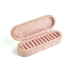 Roze fluwelen reiskistje voor sieraden, kleine draagbare opbergdoos met gouden ritssluiting