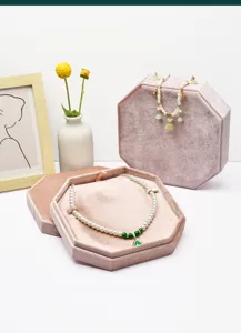 Luxury velvet jewelry box for necklaces, elegant pink octagonal storage case for pearls.