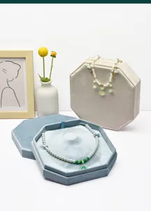 Detailed view of luxurious velvet octagonal necklace jewelry box storage display case.
