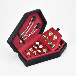 Gothic black velvet coffin jewelry box with red interior, perfect for rings and necklaces.