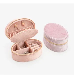 Portable velvet jewelry box with zipper, pink travel ring and necklace organizer case storage.