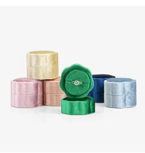 Detail shot of velvet ring box, portable mini petal design, luxury proposal ring holder.