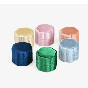 Detailed close-up of petal-shaped velvet ring box, portable mini jewelry storage case.