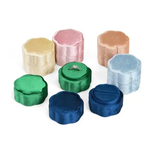 Luxury velvet ring box in various colors, portable petal design for engagement and storage.