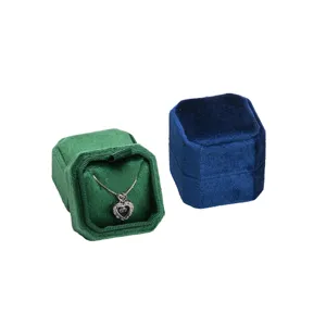 Luxury velvet octagonal jewelry box for rings and necklaces, elegant portable storage container.