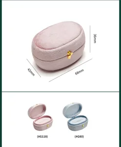 Velvet ring box oval jewelry storage box with gold clasp, elegant gift packaging display.
