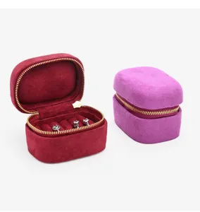 Portable velvet jewelry box, mini ring storage case with zipper for travel and daily organization.