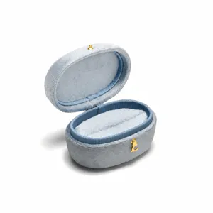 Light blue velvet oval ring box with golden clasp, perfect for luxury jewelry storage display.