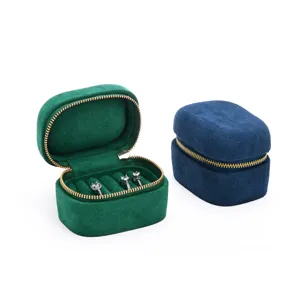 Portable velvet ring storage box with secure zipper closure and multiple ring slots.