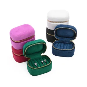 Portable mini velvet ring box jewelry storage organizer with secure zipper closure for gifts.