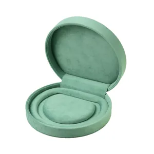 Portable velvet jewelry box, round travel storage case for rings, earrings and small accessories.