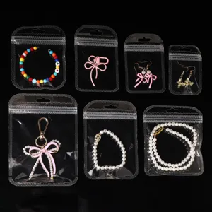 Clear transparent self-sealing jewelry storage bags with various cute DIY accessories.