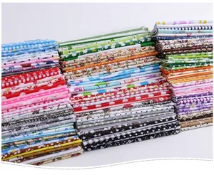 Cotton floral fabric bundles for DIY patchwork sewing crafts, assorted printed textile materials.