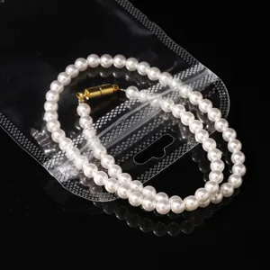 Transparent plastic ziplock bag with hanging hole for jewelry storage and small accessories.