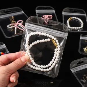 Clear self-sealing plastic jewelry bags detail shot, showing smooth rounded corners.