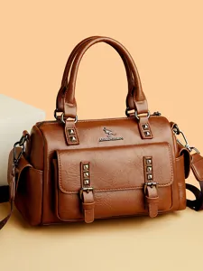 Stylish brown PU leather women handbag with metal rivets and shoulder strap for daily use.