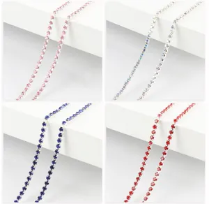 Close-up detail of colorful rhinestone claw chain, dense crystal trim for DIY jewelry craft.