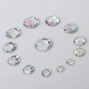 Closeup of round faceted acrylic rhinestones with double holes, ideal for DIY crafts.