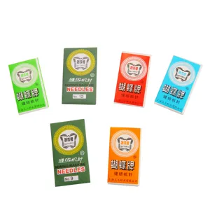 Detailed view of various colored Butterfly brand home sewing machine needle packaging packets.
