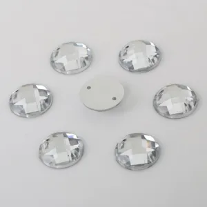 Closeup of faceted round acrylic sew-on rhinestones with double holes for DIY jewelry making.