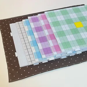 Fuse bead pegboards set, colorful square grid DIY craft boards for handmade art projects.