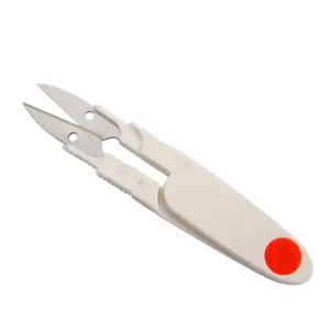 Close-up detail of the stainless steel double-head U-shaped thread scissors with white handle.