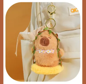 Cute capybara plush keychain bag charm, lovely stuffed animal pendant with floral wreath.