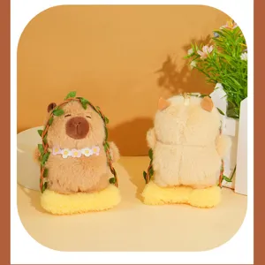 Cute capybara plush toy keychain with green vine and flower collar, soft stuffed doll pendant.