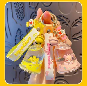 Süßer ölgefüllter Geleeflaschen-Schlüsselanhänger mit Glocke und Bonbon-Anhänger, trendiges Taschenaccessoire.