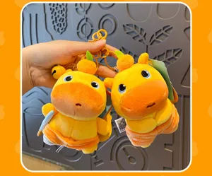 Cute orange capybara plush keychain detail, soft stuffed animal bag charm pendant.