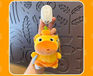 Cute capybara plush keychain toy with orange hat, soft stuffed animal bag charm accessory.