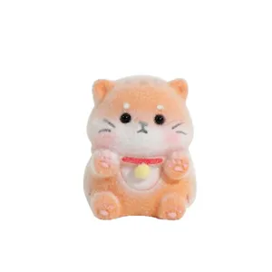 Cute flocked orange cat figurine toy, perfect for car dashboard and office desktop decoration.