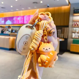 Süßer Katzen Schlüsselanhänger Cartoon Harz Taschenanhänger mit geflochtenem Seil und Autoschlüssel.