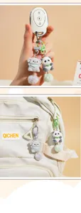 Cute animal plush keychain and bag charm with fluffy pom-pom detail for backpack and keys.