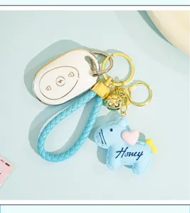 Cute leather pony keychain with heart pendant and braided strap, stylish bag charm for students.