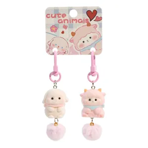 Cute flocked animal keychains pair with soft pom pom plush charms for stylish school bags.