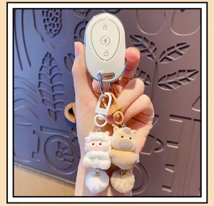 Cute zodiac plush couple keychain with fluffy pompom and car key fob case pendant accessory.