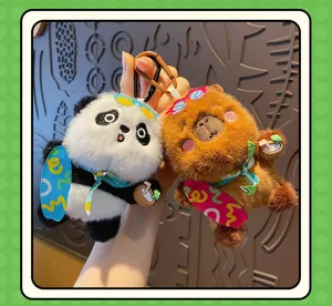 Cute panda and capybara plush keychain detail shot, showing soft fabric and cute skateboard decor.