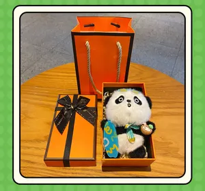 Cute panda plush toy keychain gift box set with skateboard and coconut accessories.